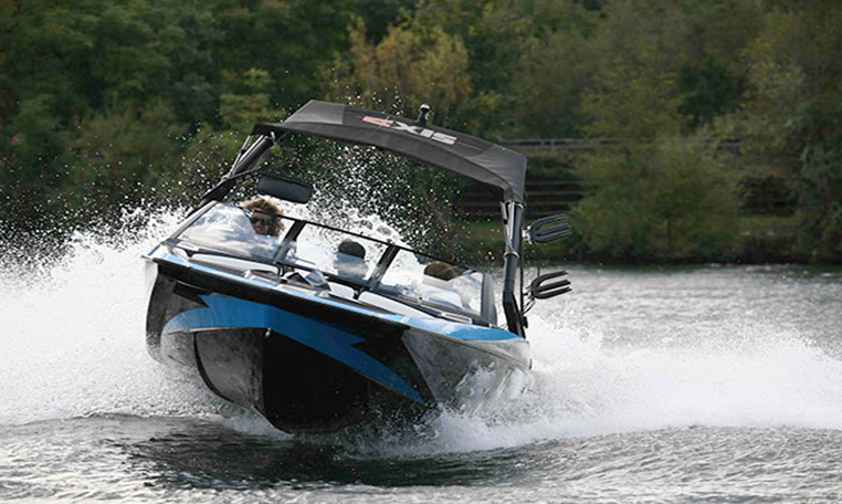 blue wakeboarding boat