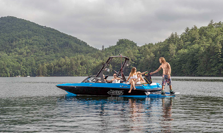 blue wakeboarding boat