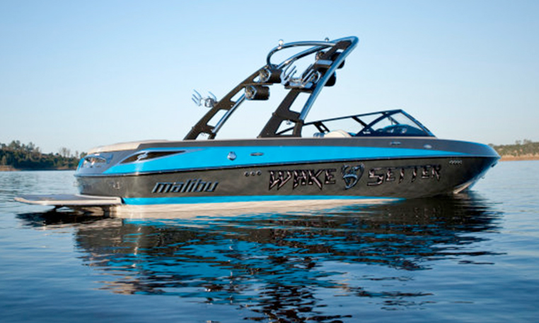 blue wakeboarding boat