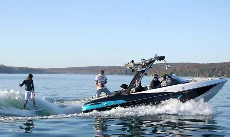 blue wakeboarding boat