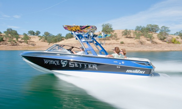 blue wakeboarding boat